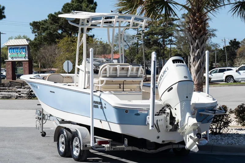 Slide: The Image of 2020 Carolina Skiff 24 Ultra Elite boat on trailer, parked near Neuse Sport Shop. - 4