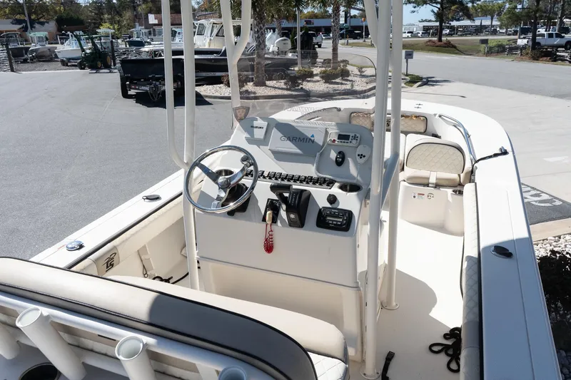 Slide: The Image of 2020 Carolina Skiff 24 Ultra Elite boat interior with steering console and seating. - 9
