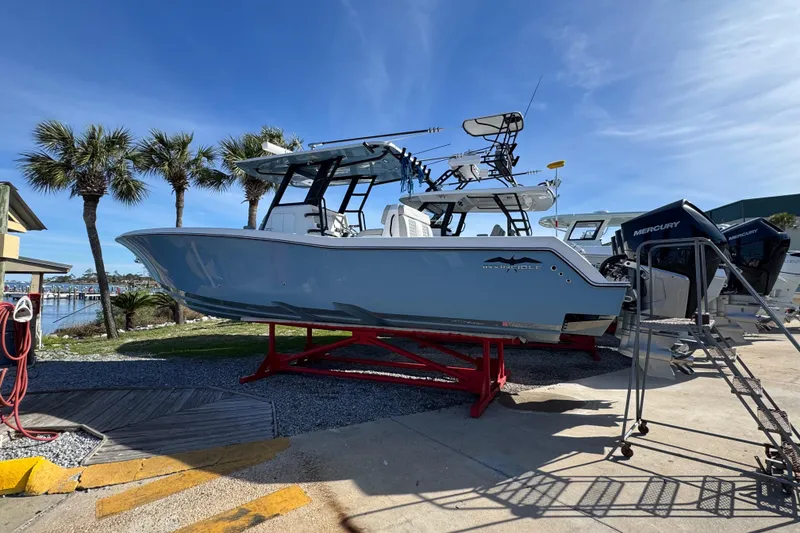 The Image of 2021 Invincible 36 Open Fisherman boat on display with palm trees in the background. - 1