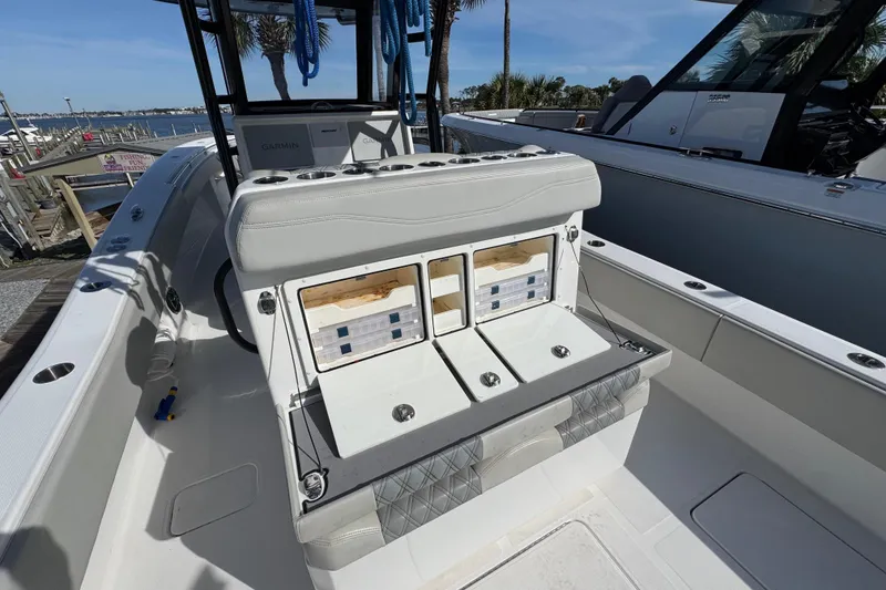 Slide: The Image of 2021 Invincible 36 Open Fisherman boat interior with storage compartments open. - 10