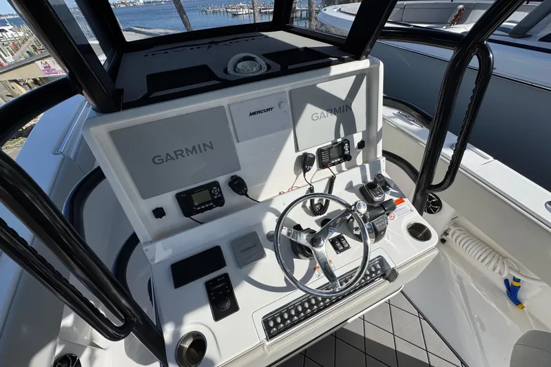 Slide: The Image of 2021 Invincible 36 Open Fisherman helm with Garmin electronics and Mercury controls. - 11