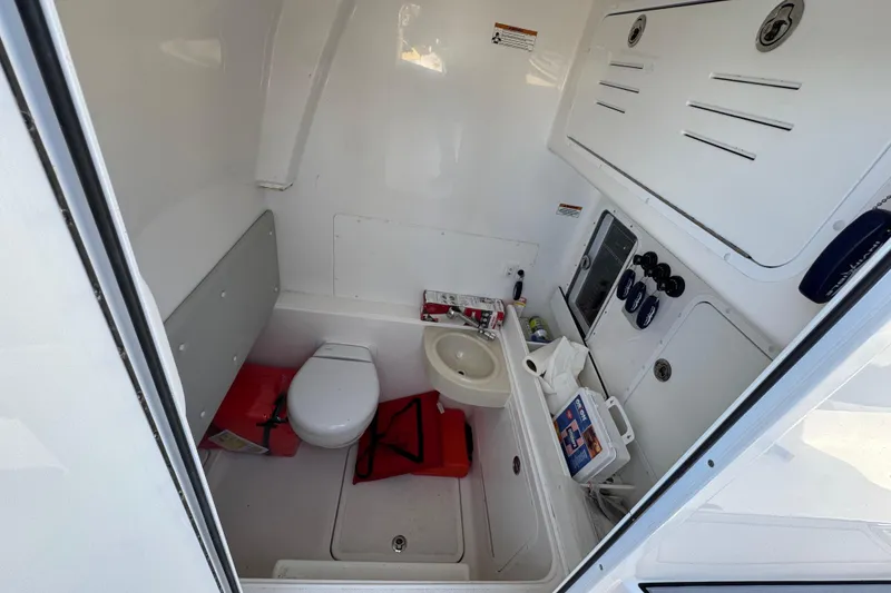 Slide: The Image of 2021 Invincible 36 Open Fisherman boat interior with toilet and sink. - 12