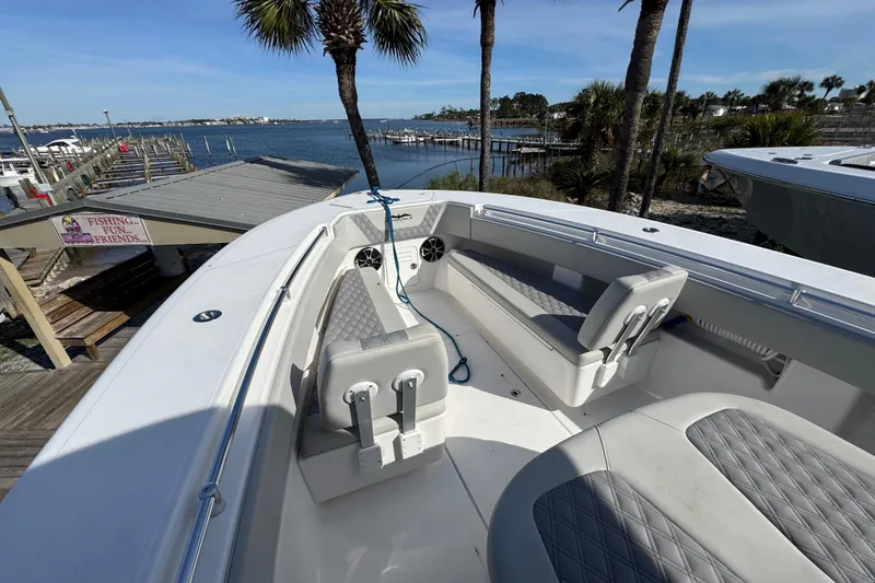 Slide: The Image of 2021 Invincible 36 Open Fisherman boat docked by a scenic waterfront. - 15