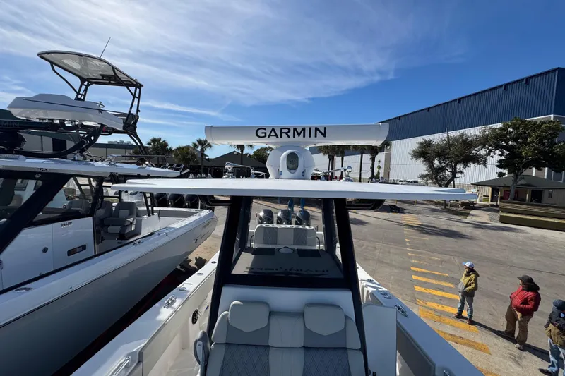 Slide: The Image of 2021 Invincible 36 Open Fisherman boat with Garmin radar, docked outdoors. - 16