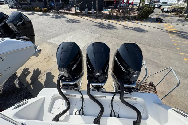 Slide: The Image of Triple Mercury outboard engines on a 2021 Invincible 36 Open Fisherman boat. - 21