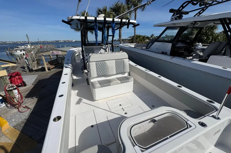 Slide: The Image of 2021 Invincible 36 Open Fisherman boat docked by the waterfront. - 4