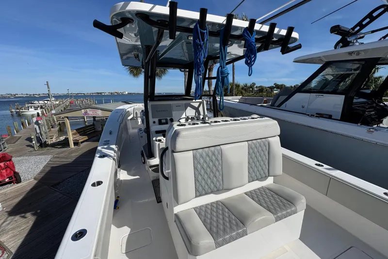 Slide: The Image of 2021 Invincible 36 Open Fisherman boat docked by the waterfront. - 6