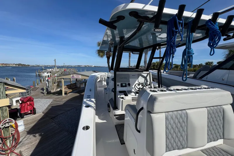 Slide: The Image of 2021 Invincible 36 Open Fisherman boat docked by the waterfront. - 8