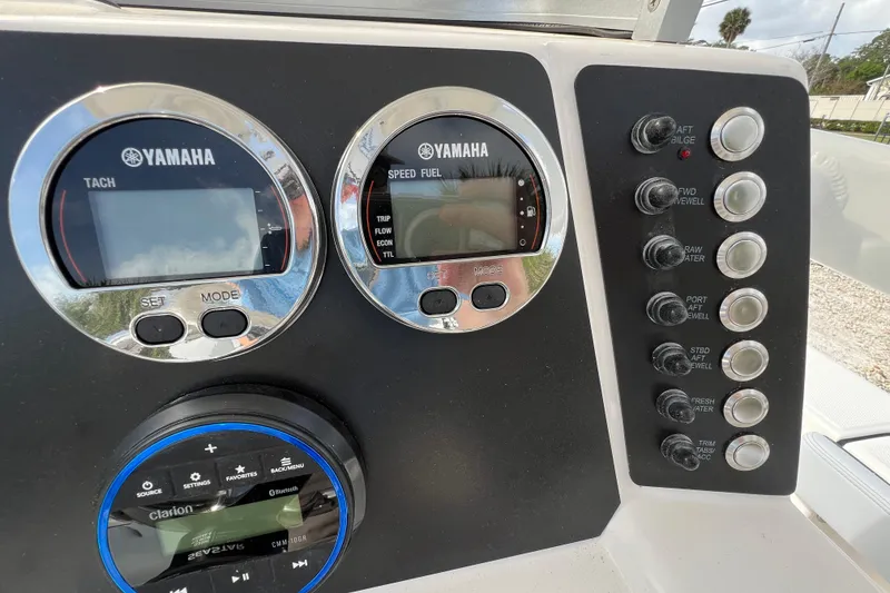 Slide: The Image of Control panel of 2026 Robalo 226 Cayman boat with Yamaha gauges and Clarion audio system. - 16