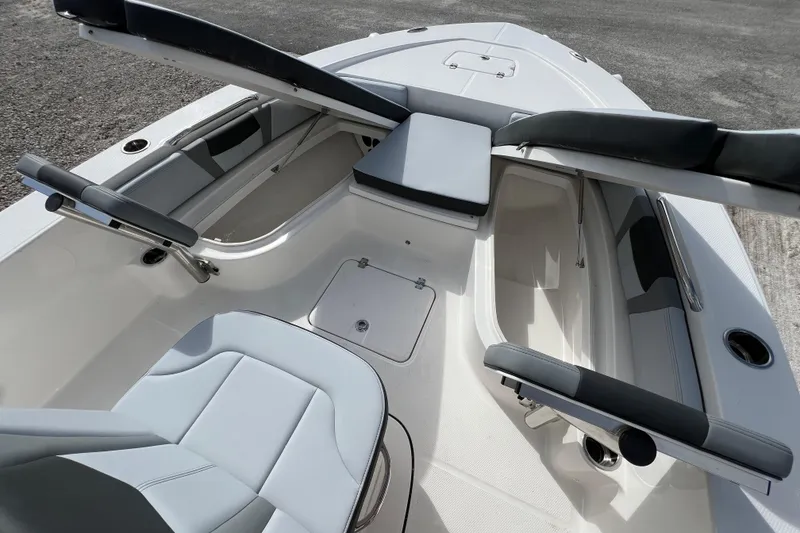 Slide: The Image of 2026 Robalo 226 Cayman boat interior with seating and storage compartments. - 21