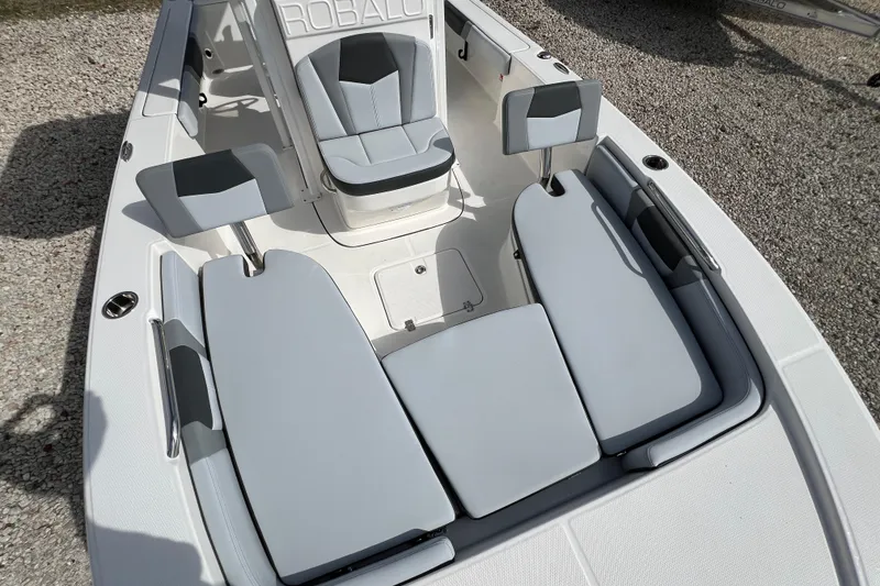 Slide: The Image of 2026 Robalo 226 Cayman boat interior with cushioned seating and modern design. - 22