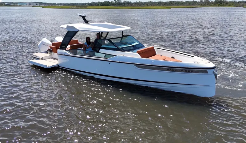Slide: The Image of Saxdor 320 GTO 2027 on calm water, featuring a sleek design and comfortable seating. - 37
