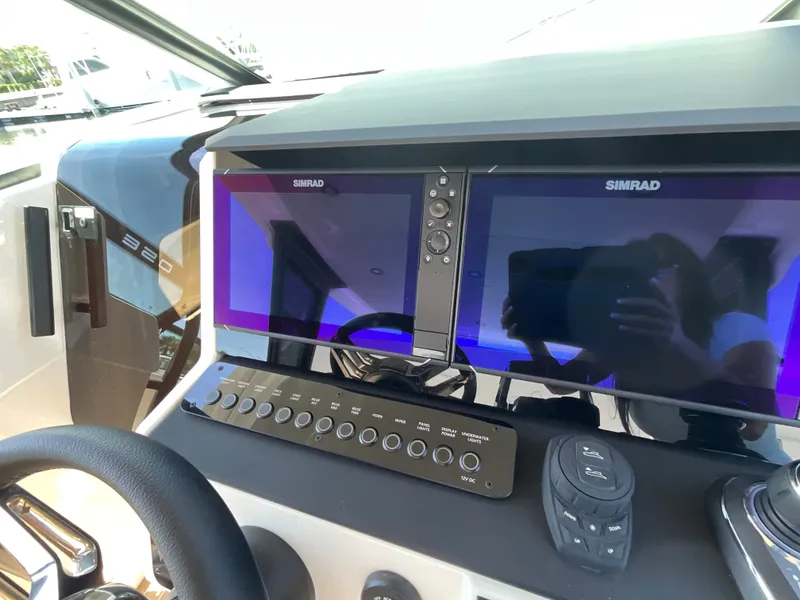 Slide: The Image of The image shows the cockpit of a Saxdor 320 GTO with modern Simrad displays. - 27