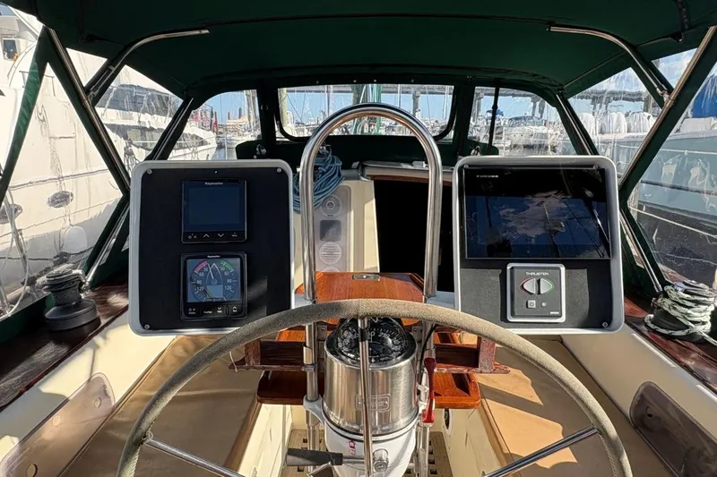 Slide: The Image of Cockpit view of 1981 Norseman 447 sailboat with navigation instruments and steering wheel. - 15