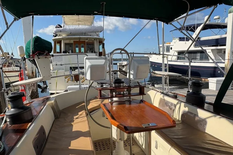 Slide: The Image of Cockpit view of a 1981 Norseman 447 sailboat docked at a marina. - 18