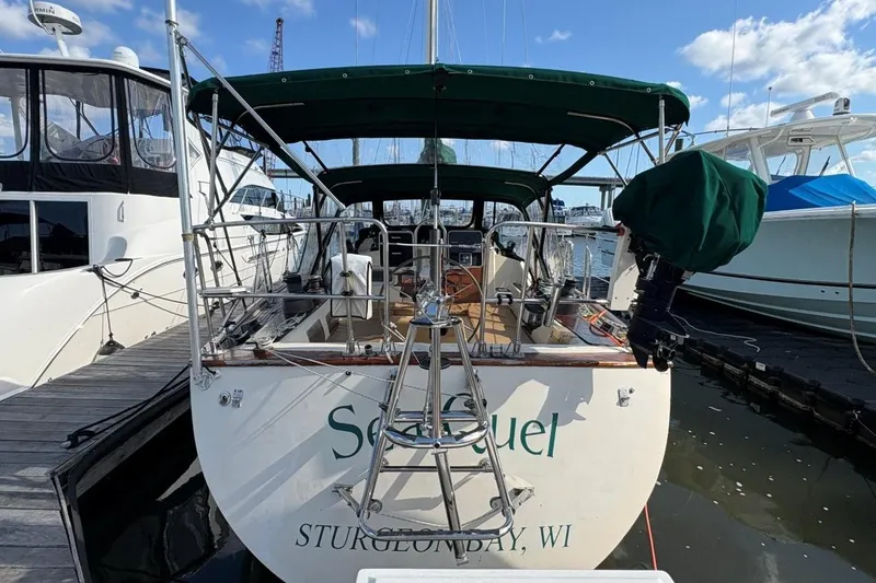 Slide: The Image of Sailboat docked at marina, Norseman 447, 1981 model, green canopy, Sturgeon Bay, WI. - 2