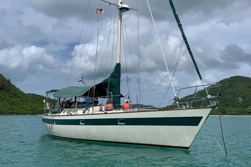 Slide: The Image of Sailboat Norseman 447, 1981 model, anchored in scenic tropical waters. - 41
