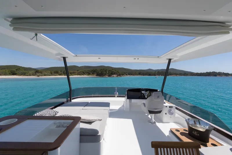 Slide: The Image of Luxury Fountaine Pajot MY 6 yacht interior, 2025 model, with stunning ocean view. - 4