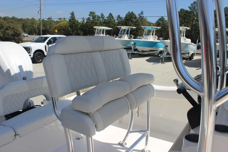 Slide: The Image of 2026 Key West 203 FS boat interior with white cushioned seating and chrome details. - 12