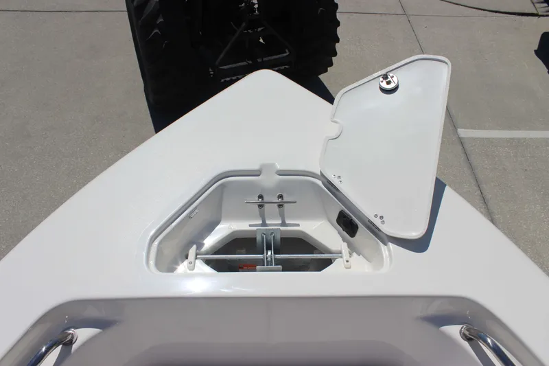 Slide: The Image of Open anchor storage compartment on 2026 Key West 203 FS boat, showcasing interior details. - 16