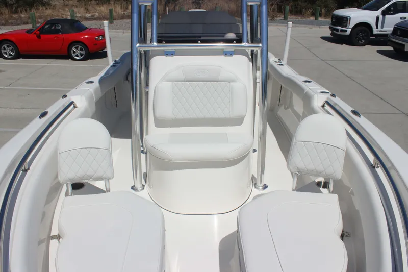 Slide: The Image of 2026 Key West 203 FS boat interior with white seating and chrome accents. - 21