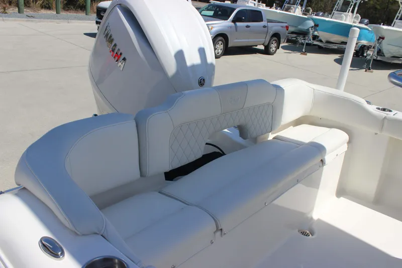 Slide: The Image of 2026 Key West 203 FS boat with Yamaha engine, featuring white cushioned seating. - 22