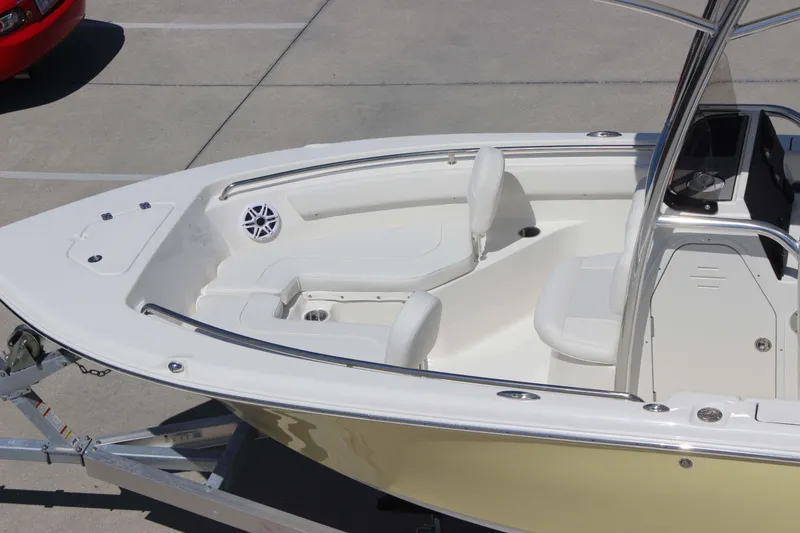 Slide: The Image of 2026 Key West 203 FS boat interior with seating and console, parked on a trailer. - 29