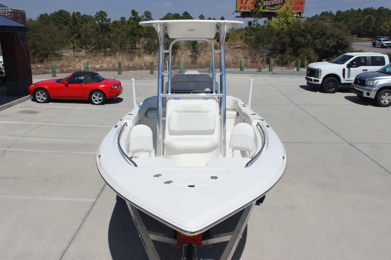 Slide: The Image of 2026 Key West 203 FS boat in parking lot, surrounded by cars. - 3