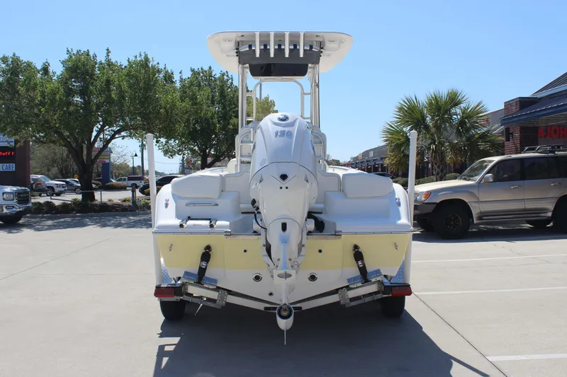 Slide: The Image of 2026 Key West 203 FS boat on trailer in parking lot, sunny day. - 5