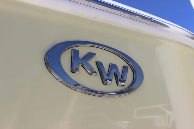 Slide: The Image of Chrome "KW" logo on 2026 Key West 203 FS boat against a light background. - 7