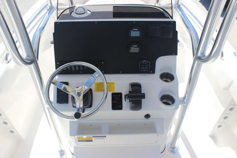 Slide: The Image of 2026 Key West 203 FS boat console with steering wheel and controls. - 9