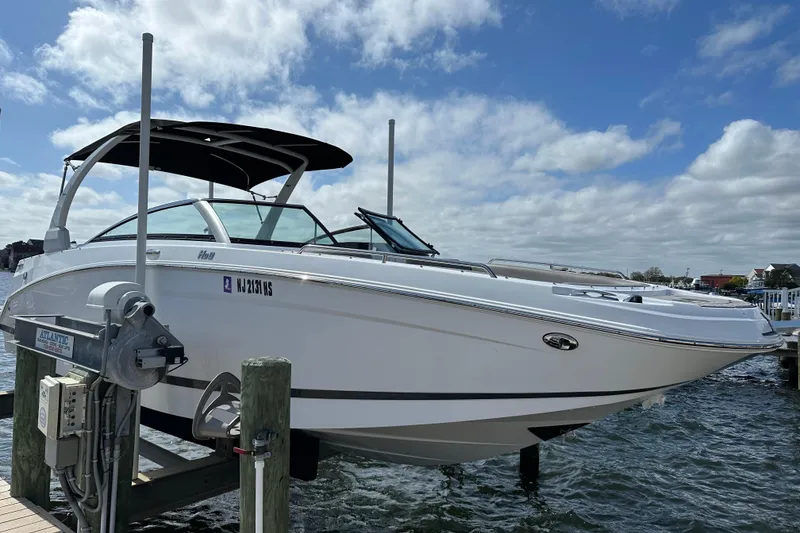 The Image of 2022 Four Winns HD8 OB boat docked on a sunny day with blue skies. - 0