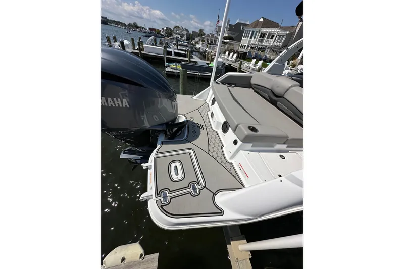 Slide: The Image of 2022 Four Winns HD8 OB boat with Yamaha outboard motor at a dock. - 21