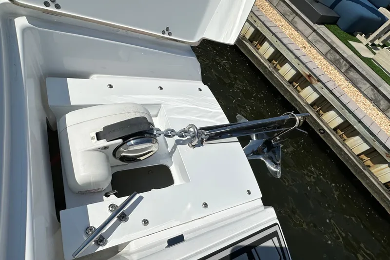 Slide: The Image of 2022 Four Winns HD8 OB boat anchor system by the dock. - 24