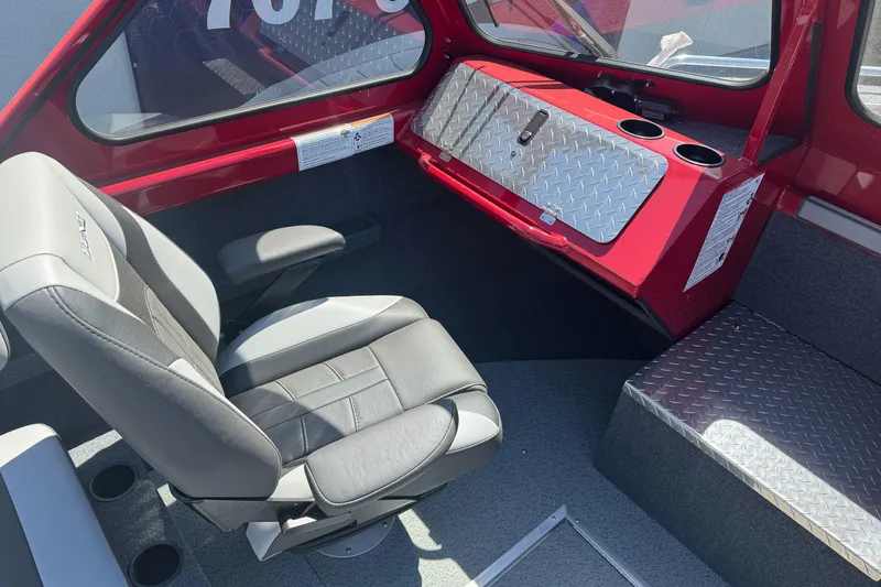 Slide: The Image of Interior of 2026 Lund 210 Heavy Gauge boat with modern seating and diamond plate accents. - 13