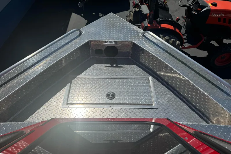 Slide: The Image of 2026 Lund 210 Heavy Gauge boat with diamond plate deck, viewed from above. - 14