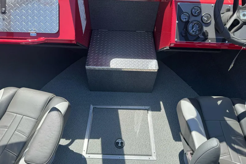 Slide: The Image of Interior of 2026 Lund 210 Heavy Gauge boat with seating and control panel. - 15
