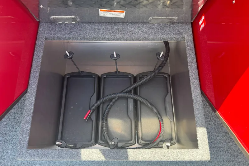 Slide: The Image of Battery compartment of 2026 Lund 210 Heavy Gauge boat with three batteries. - 16