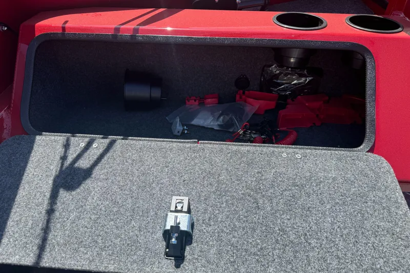 Slide: The Image of Open storage compartment in 2026 Lund 210 Heavy Gauge boat, showing interior and accessories. - 18