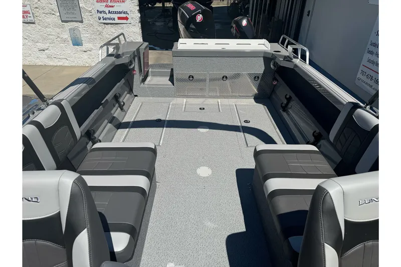 Slide: The Image of 2026 Lund 210 Heavy Gauge boat interior with gray seating and spacious layout. - 21