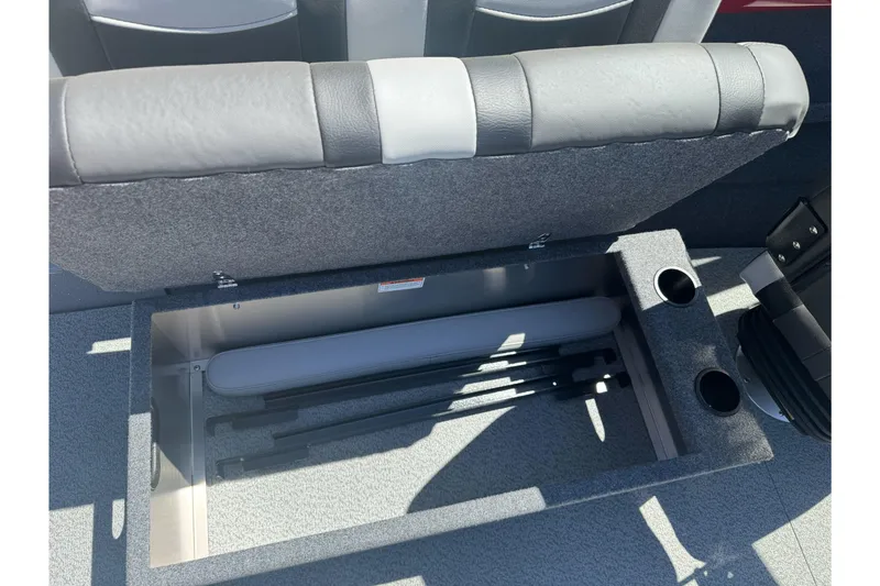 Slide: The Image of Open storage compartment in 2026 Lund 210 Heavy Gauge boat with cup holders. - 23