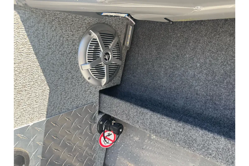 Slide: The Image of Interior of 2026 Lund 210 Heavy Gauge boat with speaker and textured flooring. - 25