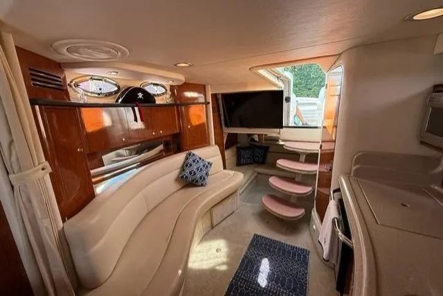 Slide: The Image of Luxurious interior of a 2006 Sea Ray Sundancer 320 yacht with plush seating and modern amenities. - 21