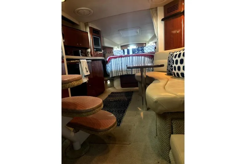 Slide: The Image of Interior of 2006 Sea Ray Sundancer 320 yacht with cozy seating and elegant decor. - 29
