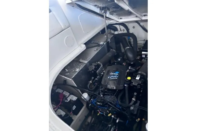 Slide: The Image of Engine compartment of a 2006 Sea Ray Sundancer 320 boat, showcasing mechanical components. - 34