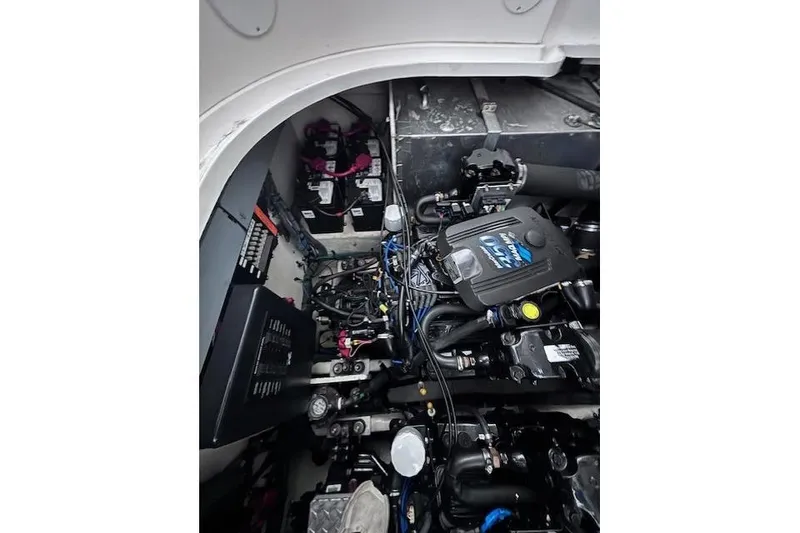 Slide: The Image of Engine compartment of a 2006 Sea Ray Sundancer 320 boat, showcasing mechanical components. - 36