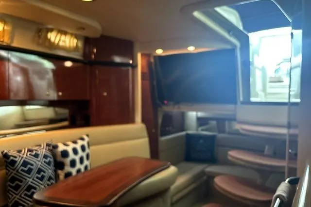 Slide: The Image of Luxurious interior of 2006 Sea Ray Sundancer 320 yacht with elegant seating and wood finishes. - 37