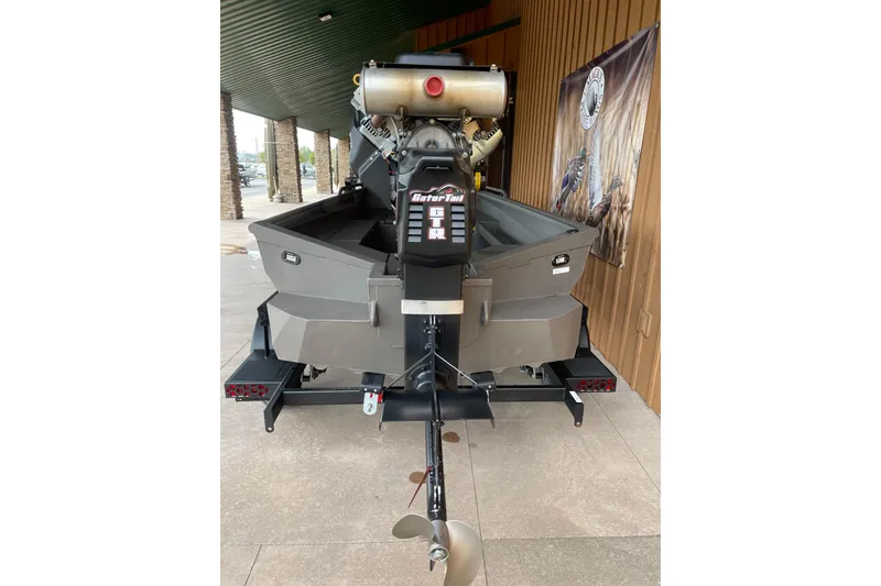 Slide: The Image of 2026 Reaper Boats 653 Timber Reaper with powerful engine, displayed outdoors. - 3