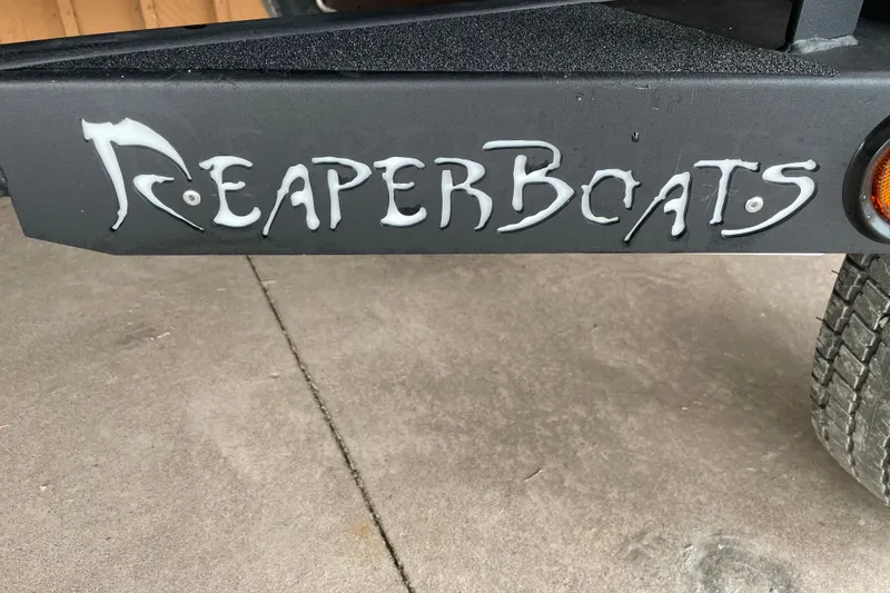 Slide: The Image of Reaper Boats logo on 2026 Reaper Boats 653 Timber Reaper trailer. - 6