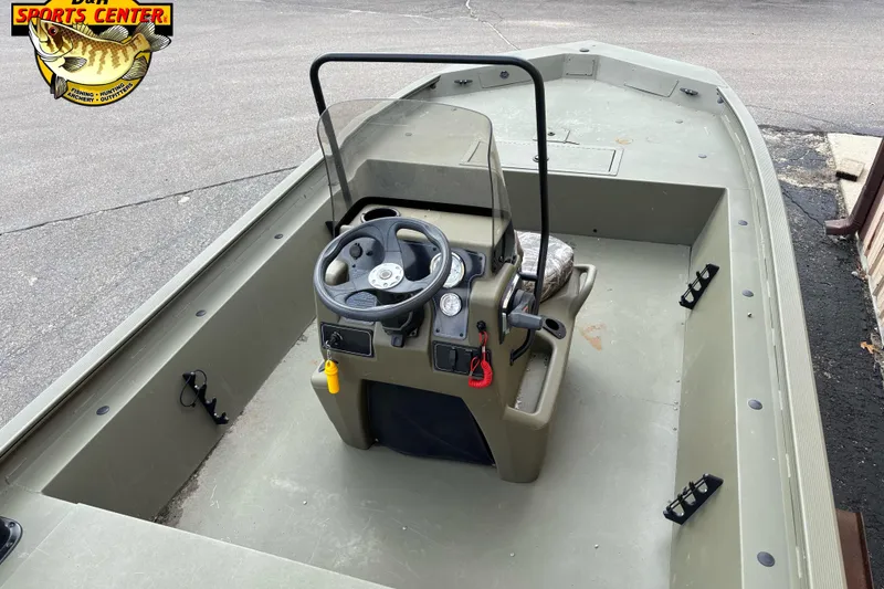 Slide: The Image of 2023 Tracker Grizzly 1860 CC boat interior with steering console and seating. - 4